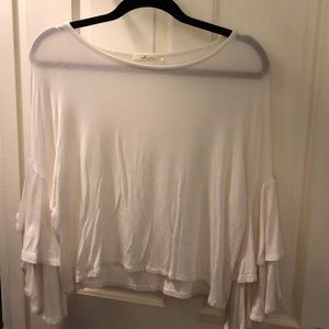 white long tiered bell-sleeved blouse